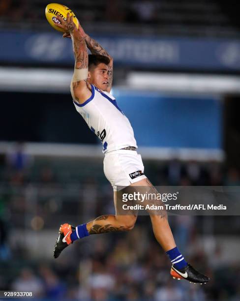 Marley Williams of the Kangaroos marks the ball during the AFL 2018 JLT Community Series match between the Richmond Tigers and the North Melbourne...