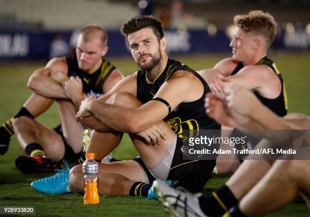 Trent Cotchin of the Tigers stretches after the AFL 2018 JLT Community Series match between the Richmond Tigers and the North Melbourne Kangaroos at...