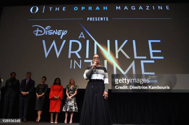 Oprah Winfrey speaks on stage as Reese Witherspoon, Mindy Kaling, Gugu Mbatha-Raw, Jim Whitaker and Tendo Nagenda react O, The Oprah Magazine hosts...
