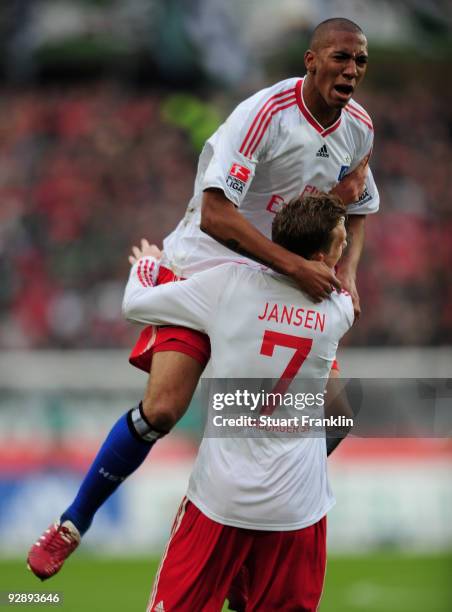 Marcell Jansen of Hamburg celebrates scoring his team's first goal with Jerome Boateng during the Bundesliga match between Hannover 96 and Hamburger...