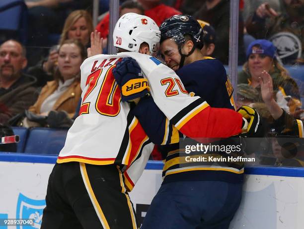 Curtis Lazar of the Calgary Flames and Nicholas Baptiste of the Buffalo Sabres get into a scuffle during the second period at KeyBank Center on March...