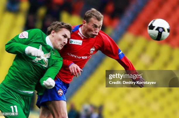 Vasili Berezutskiy of PFC CSKA Moscow competes for the ball with Aleksandr Bukharov of FC Rubin Kazan during the Russian Football League Championship...