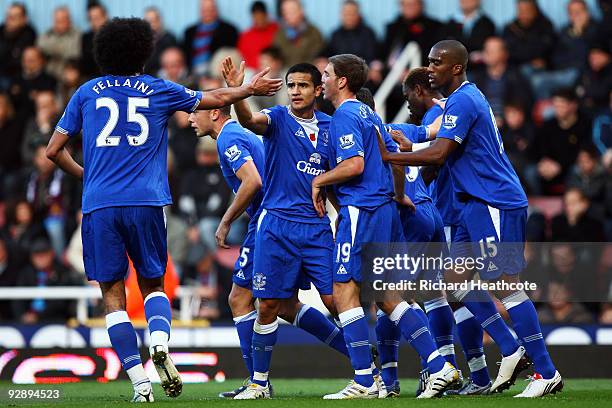 Louis Saha of Everton celebrates scoring the first goal of the game with team mates during the Barclays Premier League match between West Ham United...