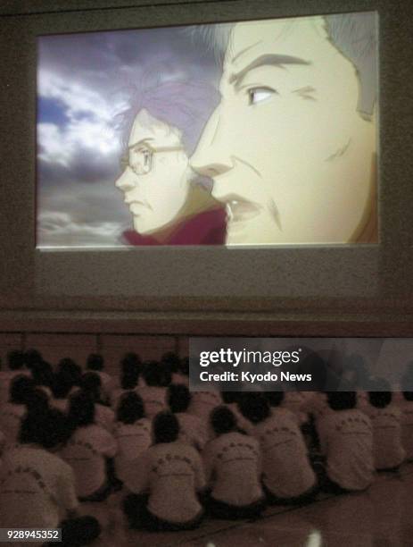 Japanese junior high school students watch the documentary animation movie "Megumi" in Honjo, Saitama Prefecture, on May 23, 2008. The government has...