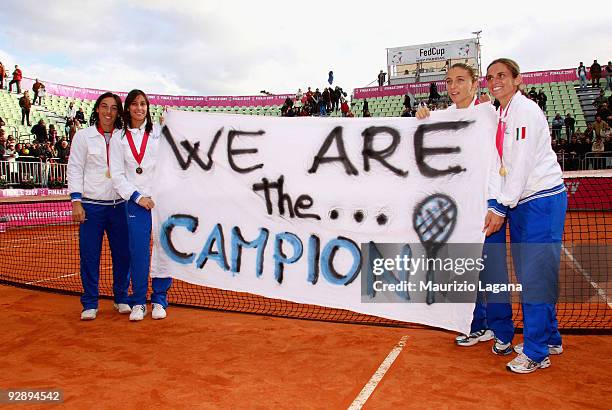 Francesca Schiavone,Flavia Pennetta, Sara Errani and Roberta Vinci of Italy show a champions banner during the awards ceremony after the final of the...