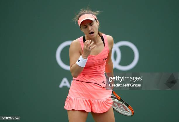 Lauren Davis reacts after losing a point to Samantha Stosur of Australia during the first round of the BNP Paribas Open at the Indian Wells Tennis...