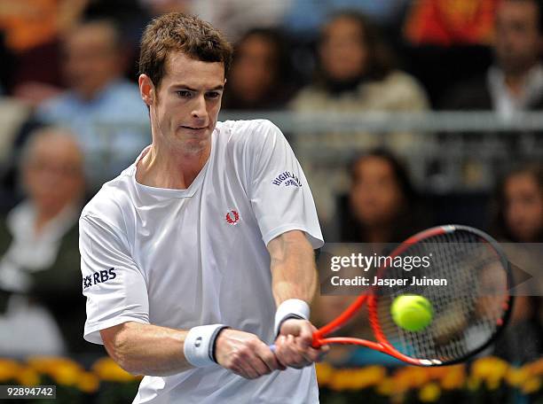 Andy Murray of Great Britain hits a double handed backhand to Mikhail Youzhny of Russia during the final of the ATP 500 World Tour Valencia Open...