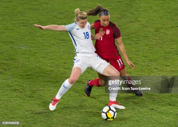 England forward Ellen White holds off United States forward Mallory Pugh during the first half of the SheBelieves Cup match between USA and England...