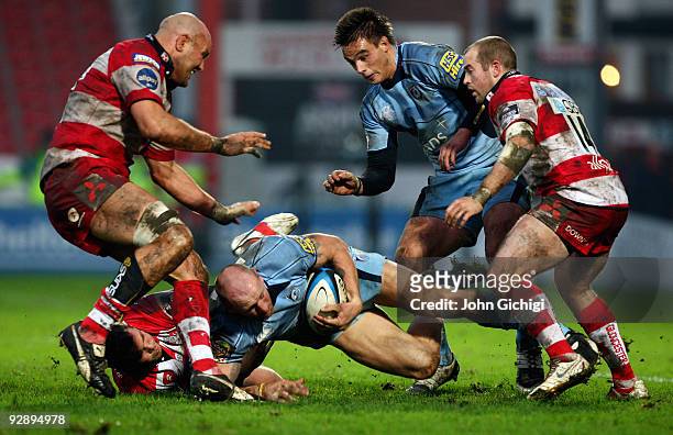 Gareth Thomas of Cardiff is tackled during the LV Anglo Welsh Cup game between Gloucester and Cardiff Blues on November 8, 2009 at Kingsholm in...