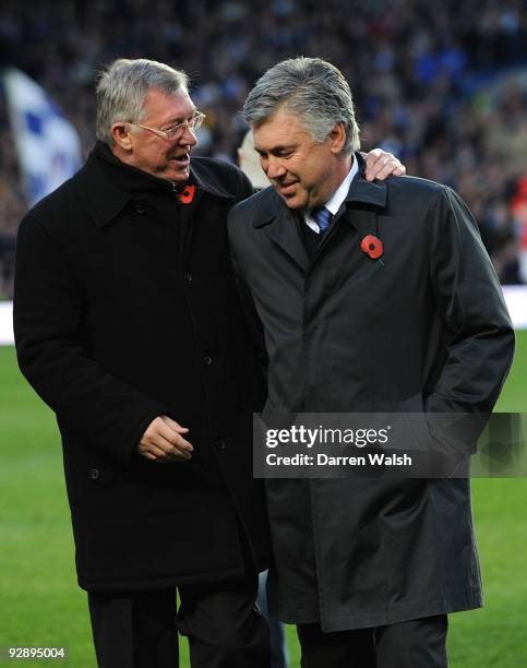 Sir Alex Ferguson , Manager of Manchester United talks to Carlo Ancelotti, Manager of Chelsea during the Barclays Premier League match between...