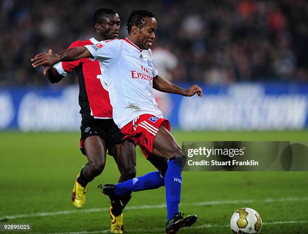 Djakpa Constant of Hannover 96 challenges Ze Roberto of Hamburg during the Bundesliga match between Hannover 96 and Hamburger SV at AWD-Arena on...