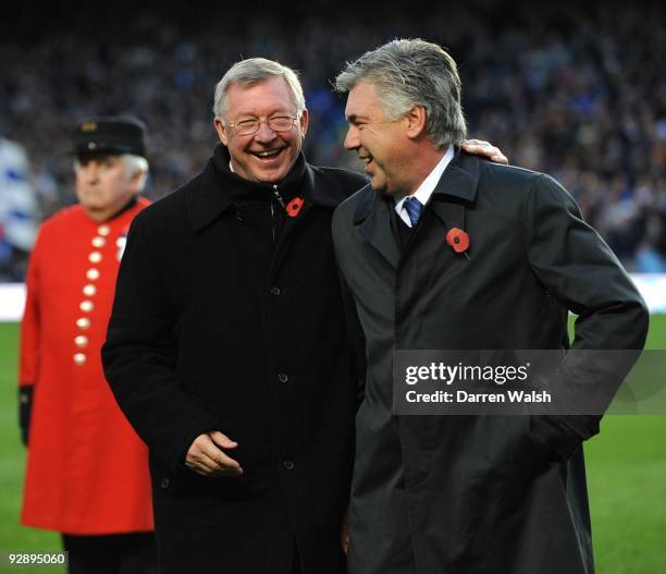 Sir Alex Ferguson , Manager of Manchester United talks to Carlo Ancelotti, Manager of Chelsea 3during the Barclays Premier League match between...