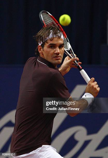 Roger Federer of Switzerland plays a backhand in his match against Novak Djokovic of Serbia in the final during Day Seven of the Davidoff Swiss...