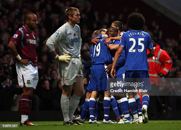 Dan Gosling of Everton celebrates scoring the second goal of the game with team mates during the Barclays Premier League match between West Ham...