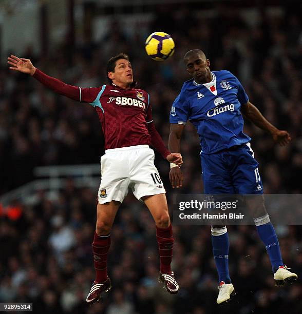 Guillermo Franco of West Ham and Sylvain Distin of Everton go for the header during the Barclays Premier League match between West Ham United and...