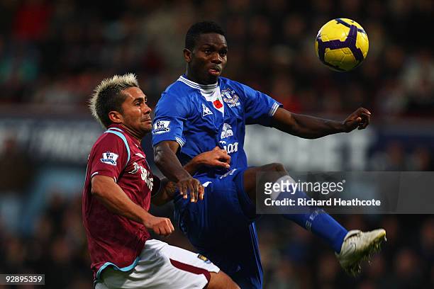 Luis Jimenez of West Ham and Joseph Yobo of Everton go for the ball during the Barclays Premier League match between West Ham United and Everton at...