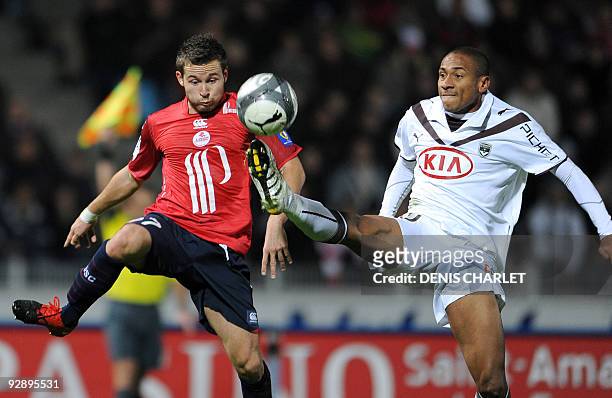 Lille's forward Pierre Alain Frau vies with Bordeaux Brazilian forward Jussie during the French L1 football match Lille vs Bordeaux on November 8,...