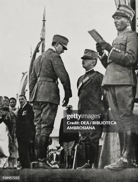 On Statute day, King Victor Emmanuel III gives the medals to the value in presence of the Abyssinian mission, Rome, Italy, from L'Illustrazione...