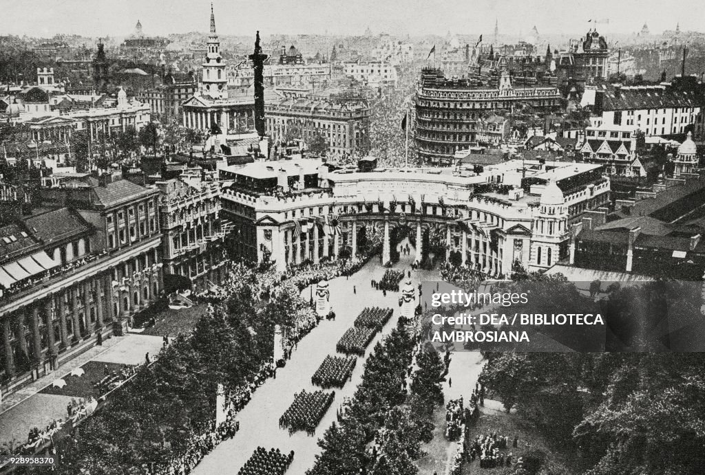 Troops march under the Admiralty Arch, London