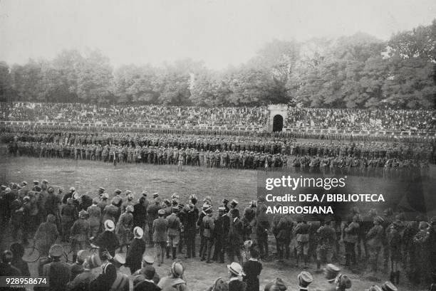 Infantrymen of the Cuneo Brigade and bersaglieri of the 12th battalion review in the Arena Civica in Milan among enthusiastic citizens, from the...