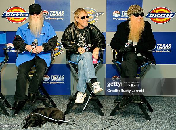 Musicians Dusty Hill, Frank Beard, and Billy Gibbons of ZZ Top talk to the media before performing at the NASCAR Sprint Cup Series Dickies 500 at...