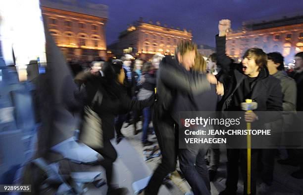 Students of French Sciences Po university cross a fake wall representing the Berlin Wall on November 8, 2009 on the Place Stanislas in Nancy, eastern...