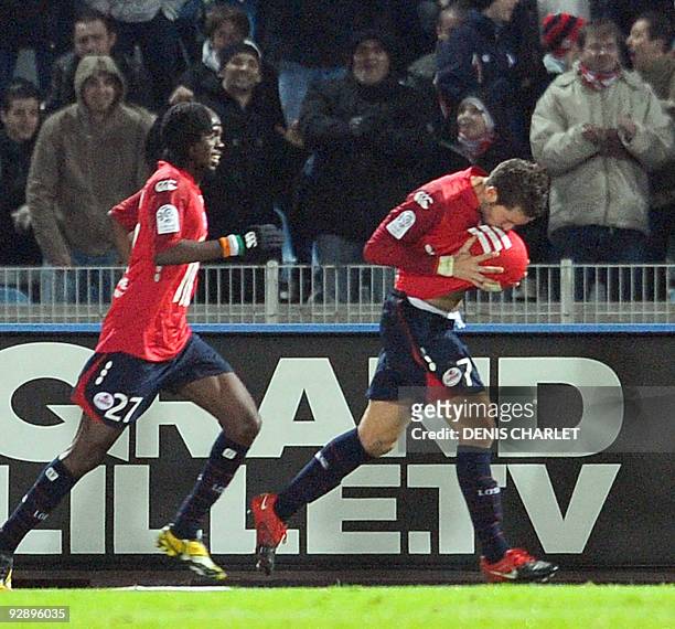 Lille midfielder Yohan Cabaye jubilates with teammate Gervinho after scoring a goal during the French L1 football match Lille vs Bordeaux on November...
