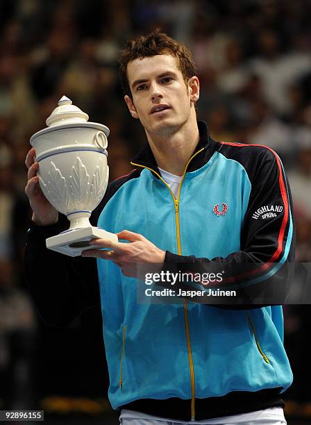 Andy Murray of Great Britain holds up the trophy celebrating his win over Mikhail Youzhny of Russia in the final of the ATP 500 World Tour Valencia...