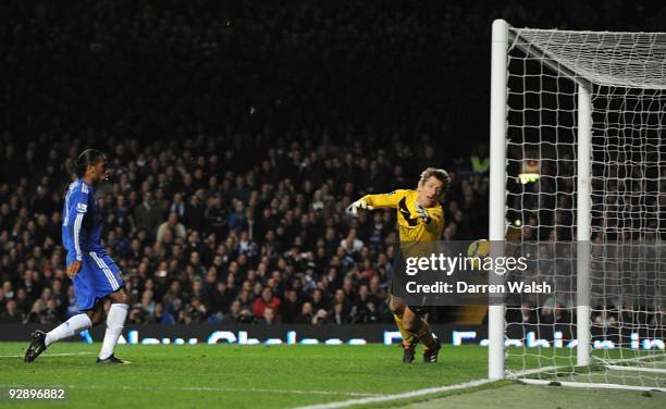 Edwin Van der Sar of Manchester United dives in vain as John Terry's header crosses the line during the Barclays Premier League match between Chelsea...