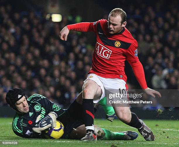 Wayne Rooney of Manchester United clashes with Petr Cech of Chelsea during the FA Barclays Premier League match between Chelsea and Manchester United...