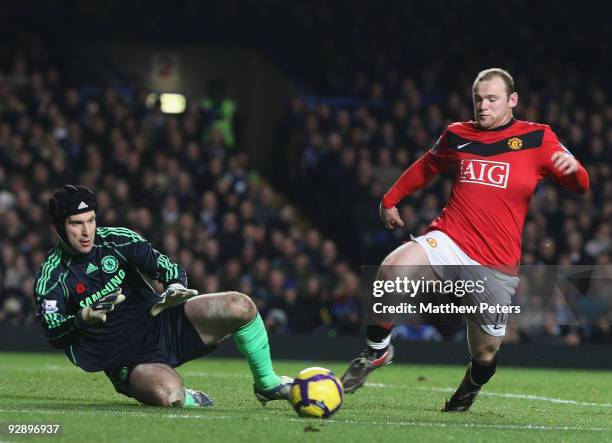 Wayne Rooney of Manchester United clashes with Petr Cech of Chelsea during the FA Barclays Premier League match between Chelsea and Manchester United...