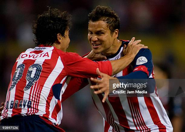 Omar Bravo and Aaron Galindo of Chivas celebrate scored goal during their match as part of the Closing 2009 Tournament in the Mexican Football League...