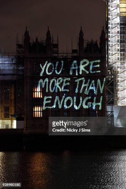 Messages are projected onto the Houses of Parliament to mark the start of International Women's Day on March 8, 2018 in London, England.