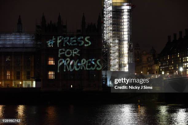 Messages are projected onto the Houses of Parliament to mark the start of International Women's Day on March 8, 2018 in London, England.