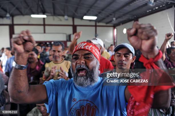 Supporters of Honduran ousted President Manuel Zelaya participate of a meeting at a workers' union on November 8, 2009 in Tegucigalpa, Honduras. A...