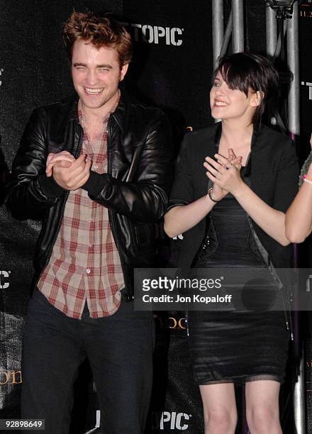 Actor Robert Pattinson and actress Kristen Stewart speak at "The Twilight Saga: New Moon" - Cast Tour at Hot Topic on November 6, 2009 in Hollywood,...