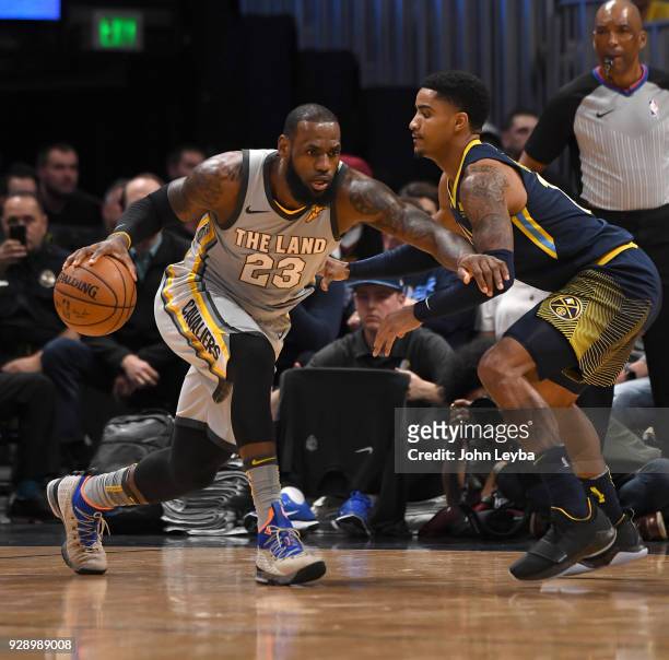 Cleveland Cavaliers forward LeBron James looks to drive past Denver Nuggets guard Gary Harris during the first quarter on March 7, 2018 at Pepsi...