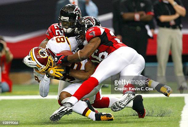 Chevis Jackson of the Atlanta Falcons defends as Erik Coleman breaks up a pass intended for Santana Moss of the Washington Redskins at Georgia Dome...