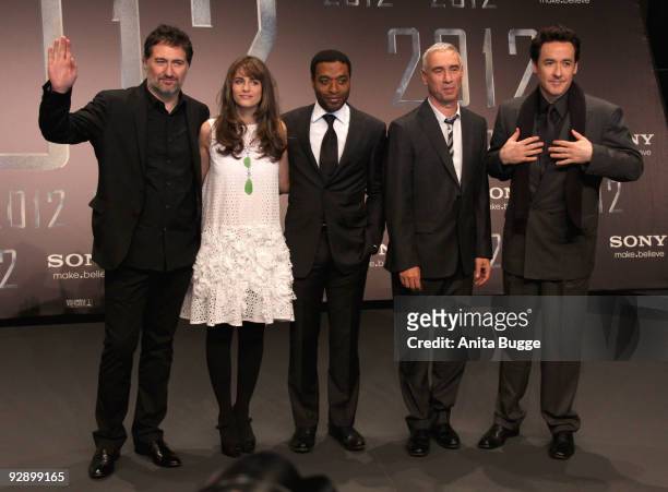 Musician Harald Kloser, actress Amanda Peet, actor Chiwetel Ejiofor, director Roland Emmerich and actor John Cusack attend the "2012" Germany...
