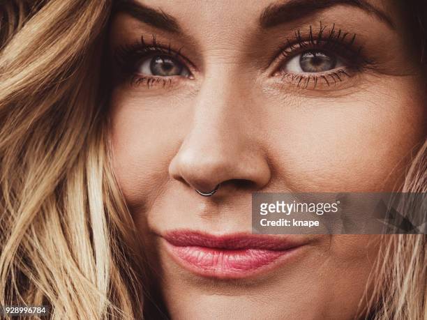 close up of woman with real septum piercing - septum stock pictures, royalty-free photos & images