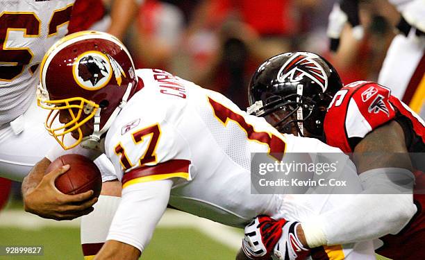 Jonathan Babineaux of the Atlanta Falcons sacks quarterback Jason Campbell of the Washington Redskins at Georgia Dome on November 8, 2009 in Atlanta,...