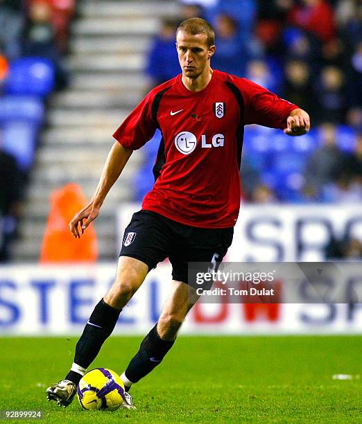 Brede Hangeland of Fulham runs with the ball during the Barclays Premier League match between Wigan Athletic and Fulham at DW Stadium on November 08,...
