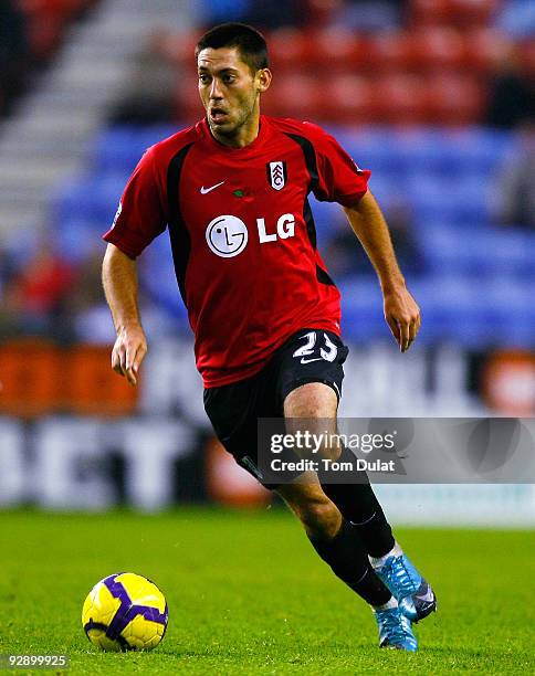 Clint Dempsey of Fulham runs with the ball during the Barclays Premier League match between Wigan Athletic and Fulham at DW Stadium on November 08,...