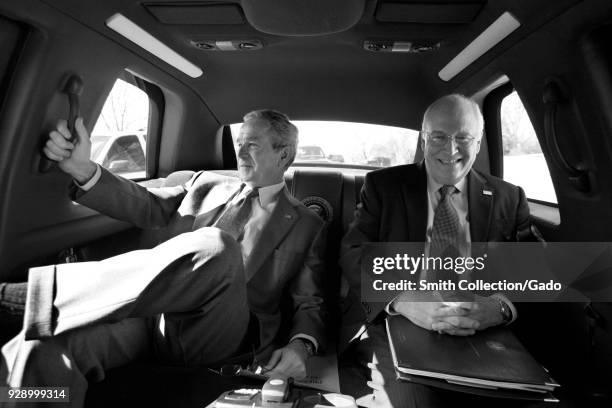 Vice President Cheney and President George W Bush riding in back of a limousine smiling, Washington DC, Washington, USA, February 28, 2008.