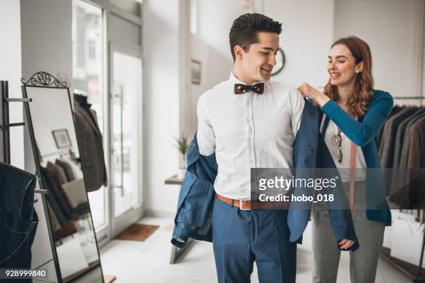 let me assist you - menswear stock pictures, royalty-free photos & images