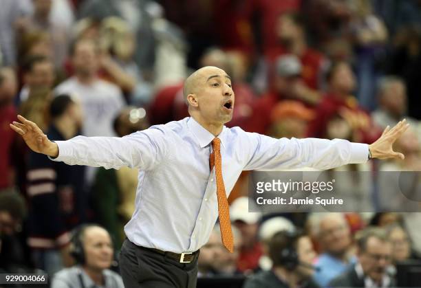 Head coach Shaka Smart of the Texas Longhorns reacts from the bench during the first round of the Big 12 Basketball Tournament against the Iowa State...