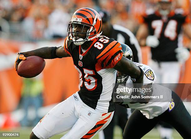 Chad Ochocinco of the Cincinnati Bengals fights to break free from Domonique Foxworth of the Baltimore Ravens at Paul Brown Stadium November 8, 2009...