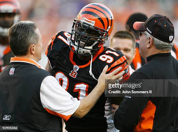 Robert Geathers of the Cincinnati Bengals reacts in pain after a hit by the Baltimore Ravens at Paul Brown Stadium on November 8, 2009 in Cincinnati,...