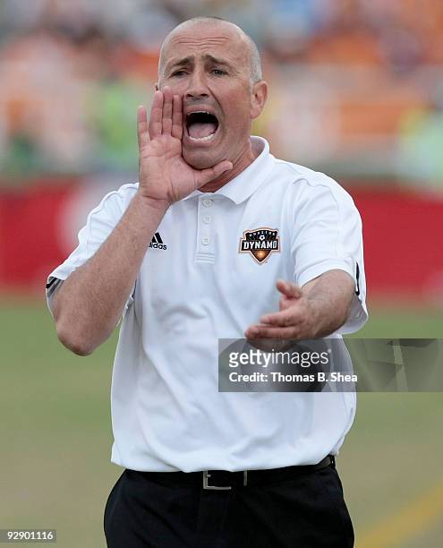 Head coach Dominic Kinnear of the Houston Dynamo yells to his players while Houston plays against the Seattle Sounders during Game Two of the 2009...