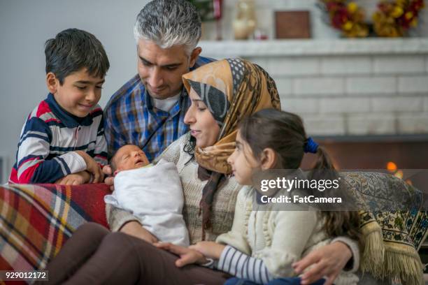 new member of the family - refugee babies stock pictures, royalty-free photos & images